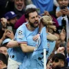 Bernardo Silva e Haaland a festejar um golo pelo Manchester City na Champions League